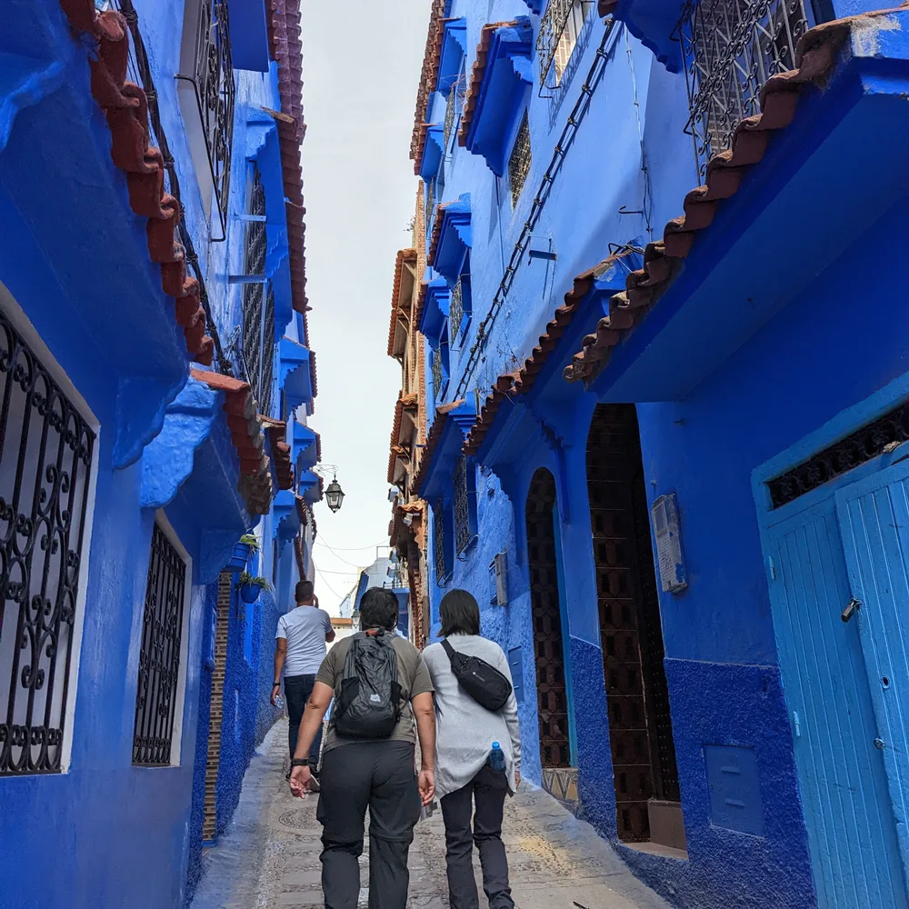 Chefchaouen blue alley walkers